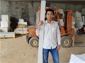 Factory worker performing quality control on StaturioVN marble window sill