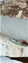 Cut StaturioVN white marble block face at the quarry