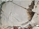 Wire-saw cutting machinery at StaturioVN white marble quarry