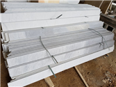 Finished white marble doorsills and window sills stacked horizontally
