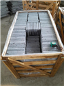 Tumbled bluestone crate close-up with measuring tape