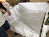 Secure wrapping with plastic sheets to protect StaturioVN tiles
