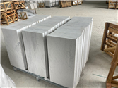 Finished StaturioVN marble tiles stacked vertically at our warehouse